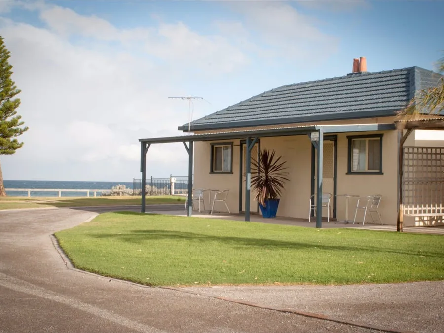 Cabin accommodation at Port Vincent with the sea behind it