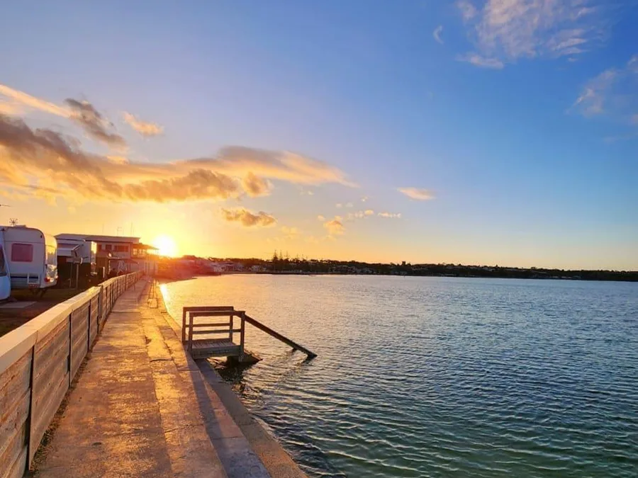 Sunset over the Port Vincent waterfront beside caravan sites