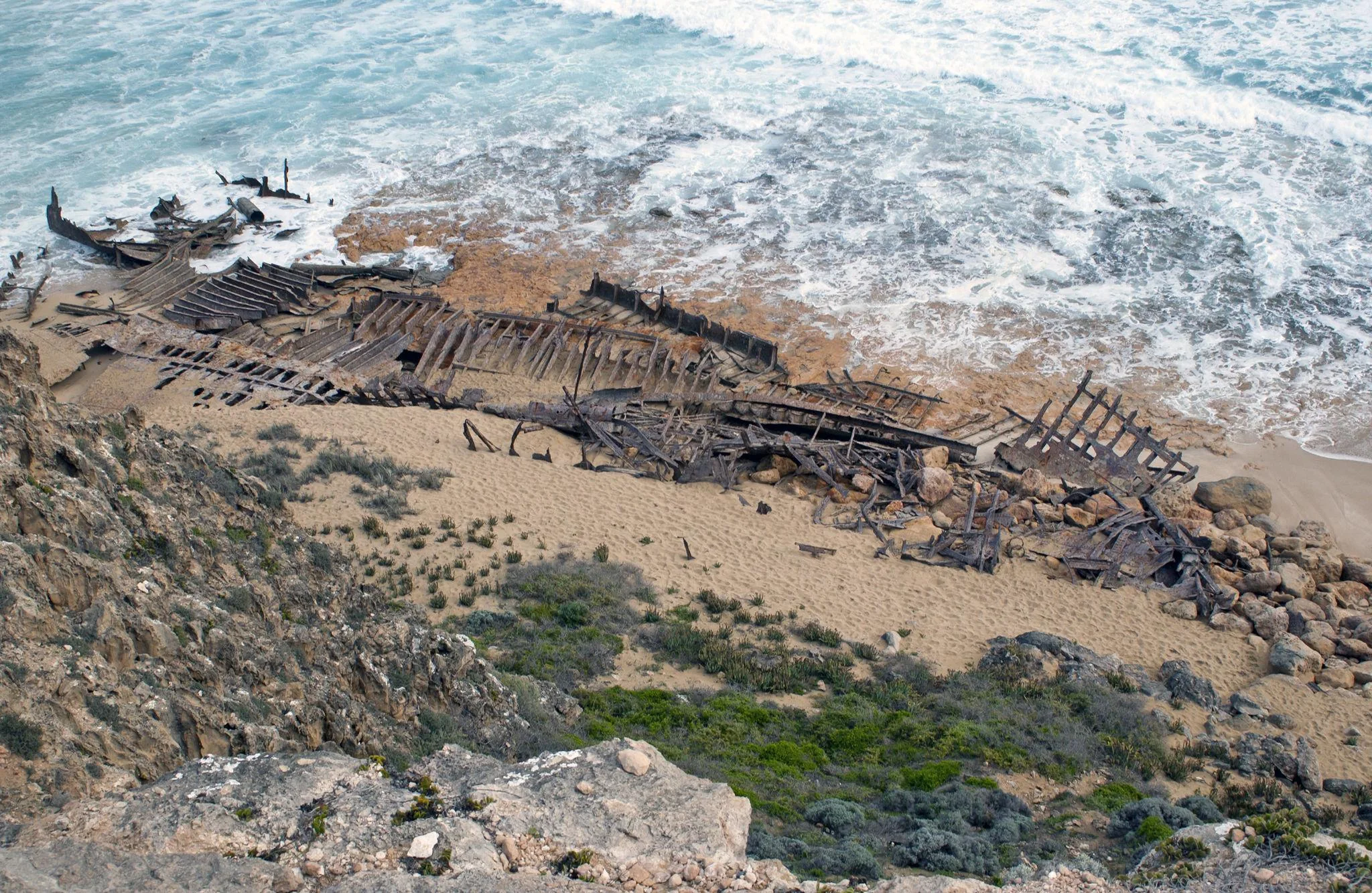 Wide coastal view of the Ethel wreck on the beach
