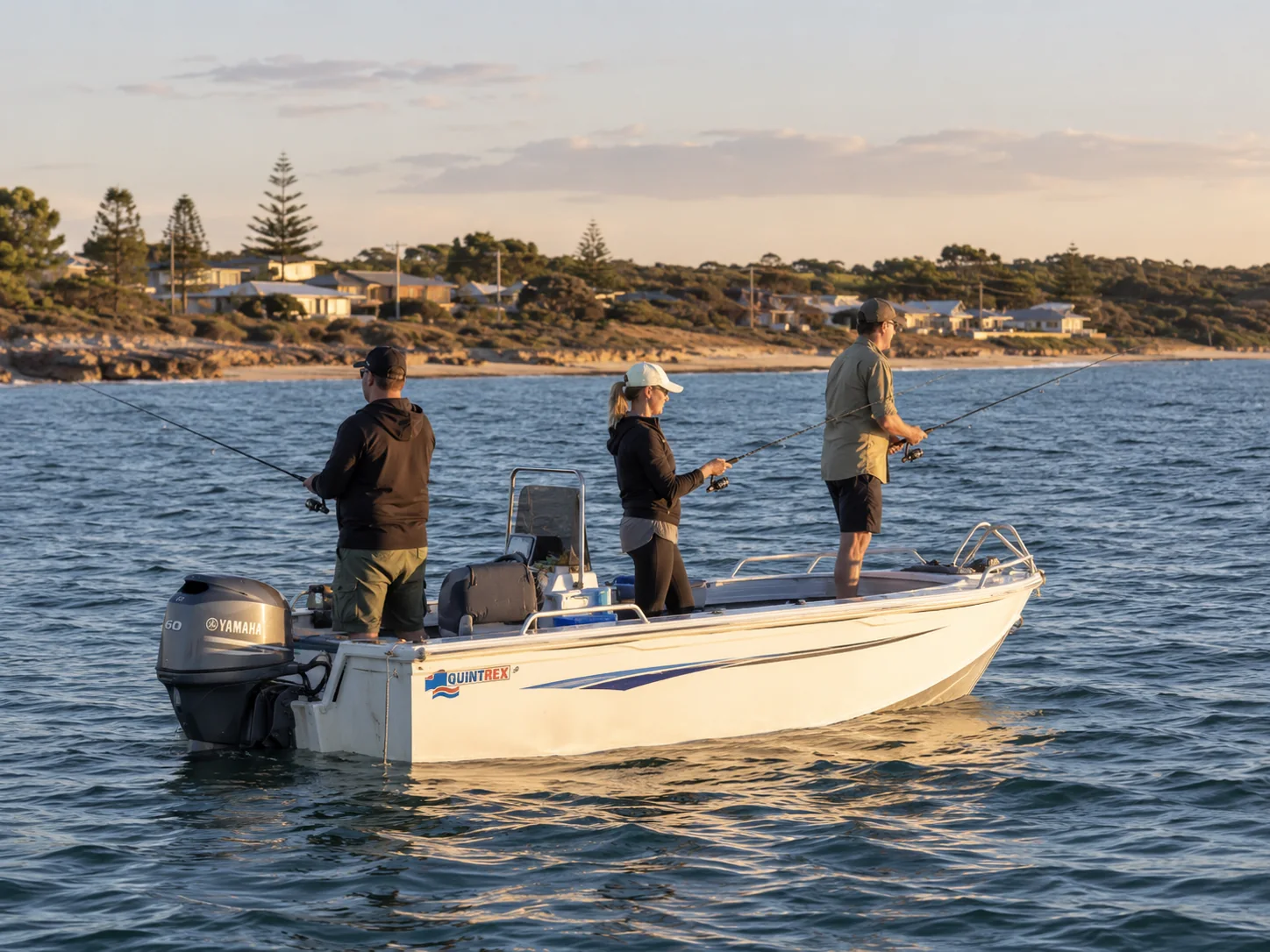 Three recreational fishers on a small boat off the Stansbury coast