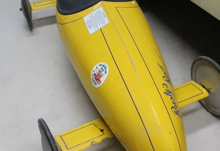 Close view of Rusty’s Racer at Stansbury Museum showing its low seat and exposed front wheel
