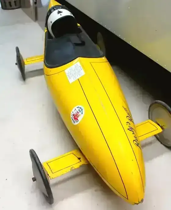 Rusty’s Racer, the yellow soapbox car displayed at Stansbury Museum